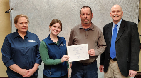 Aqua employees Devon Scallan, environmental compliance manager, and Larry Brookman, facility operator (center) accept the 2023 Silver Water Treatment Plant Performance Award for Excellence in Filtration and Backwash from Jessi Tisinger, P.E., district engineer, (left) and Dr. David Dawson, P.E., deputy field director, Virginia Department of Health Office of Drinking Water (right). (Photo: Business Wire)